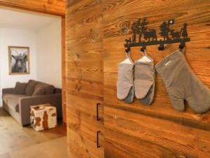 a pair of socks hanging on a wooden wall at Apartment Papillon by Interhome in Zermatt