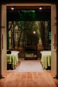 a room with two tables and a green curtain at Hotel Dębowy Biowellness & SPA Góry Sowie in Bielawa