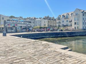 a group of buildings and a river in a city at Sandy Haven in Swanage