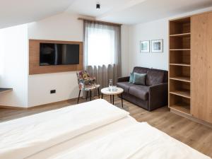 TV a/nebo společenská místnost v ubytování Hotel Blitzburg