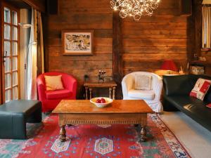 sala de estar con sillas y mesa de centro en Chalet Uberer A1 by Interhome, en Zermatt