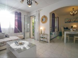 a large living room with a bed and a table at Villa Liou Miou Souleou by Interhome in Mouans-Sartoux