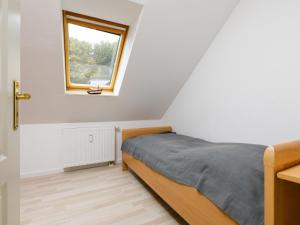 En eller flere senge i et værelse på Holiday Home Conny by Interhome