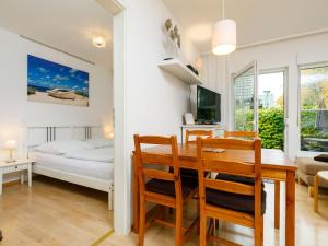 TV a/nebo společenská místnost v ubytování Apartment Am Küstenwald by Interhome + 29 fotografií
