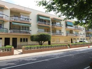 an apartment building on the side of the street at Apartamento Llançà, 2 dormitorios, 4 personas - ES-228-72 in Llança