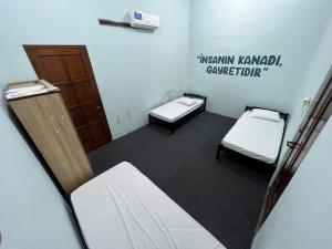 Postel nebo postele na pokoji v ubytování Faire BNB Homestay