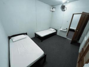 Postel nebo postele na pokoji v ubytování Faire BNB Homestay + 7 fotografií