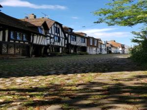 a cobblestone street with a row of houses at Nollaig Beachside Bliss - Pass the Keys in Rye +11 photos