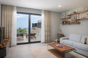 a living room with a couch and a table at Villa Harmony in Makarska
