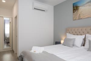 Postel nebo postele na pokoji v ubytování Villa Harmony