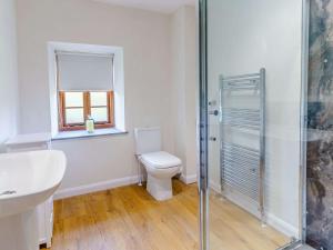 a bathroom with a toilet and a glass shower at 2 bed in Nantyglo 82706 in Nantyglo