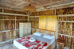 Postel nebo postele na pokoji v ubytování Kura Kura Beach