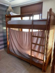Ein Bett oder Betten in einem Zimmer der Unterkunft ASNFU AUBERGe