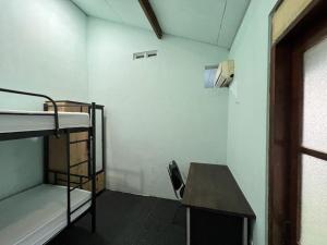Postel nebo postele na pokoji v ubytování Faire BNB Homestay