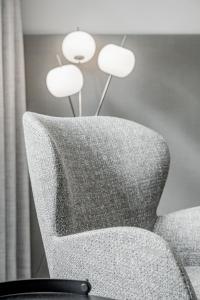 a room with a chair and a lamp at Viktoria Sölden in Sölden