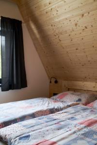 Postel nebo postele na pokoji v ubytování Resort Bobrovník