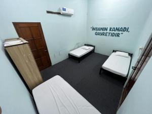 Postel nebo postele na pokoji v ubytování Faire BNB Homestay