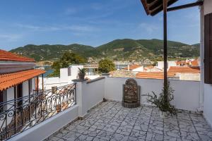 a balcony with a view of the mountains at Esperos Apartment in Skopelos Town