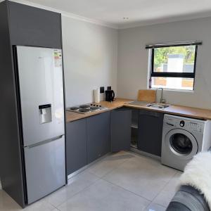 Kuchyň nebo kuchyňský kout v ubytování Urban Cosy City Haven