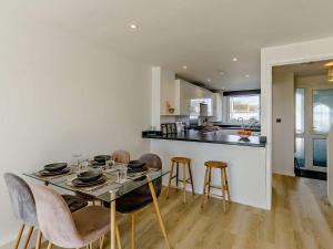 a kitchen and dining room with a table and chairs at 2 bed in Brixham 83741 in Brixham