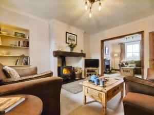 a living room filled with furniture and a fireplace at 3 Bed in Ennerdale SZ392 in Ennerdale Bridge