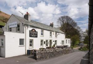 a white building with a sign in front of it at 3 Bed in Threlkeld SZ433 in Threlkeld