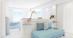 a white room with a blue bed and a mirror at Amore Rentals - Villa Giada in Sorrento