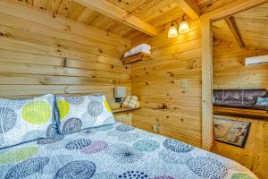a bedroom with a bed in a log cabin at Cabins at Bonefish Bay in Marathon