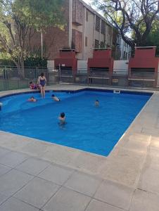 a group of people swimming in a swimming pool at La casa de Emma in Cordoba