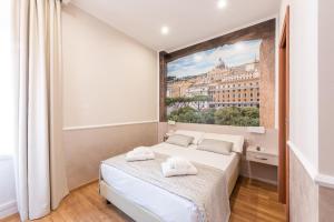 Postel nebo postele na pokoji v ubytování Top Floor Colosseo Guesthouse