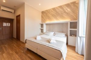 Postel nebo postele na pokoji v ubytování Top Floor Colosseo Guesthouse