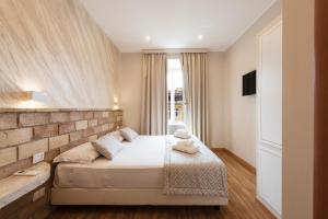 Postel nebo postele na pokoji v ubytování Top Floor Colosseo Guesthouse
