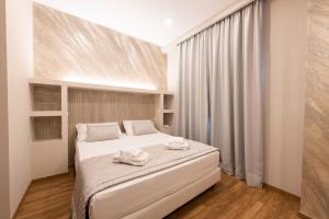Postel nebo postele na pokoji v ubytování Top Floor Colosseo Guesthouse