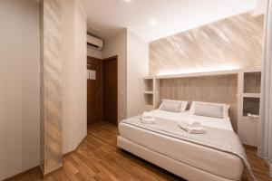 Postel nebo postele na pokoji v ubytování Top Floor Colosseo Guesthouse