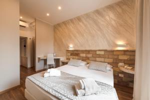 Postel nebo postele na pokoji v ubytování Top Floor Colosseo Guesthouse