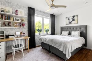 Voodi või voodid majutusasutuse Exclusive villa Stockholm toas