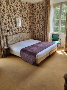 Un pat sau paturi într-o cameră la Castel Novel