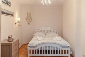 Posteľ alebo postele v izbe v ubytovaní Apartament Karpielówka View Od-nowa