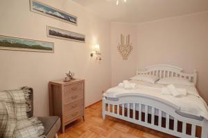 Posteľ alebo postele v izbe v ubytovaní Apartament Karpielówka View Od-nowa