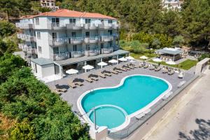 an aerial view of a hotel with a swimming pool at Green Bay in Limenaria