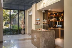 a lobby with a reception desk in a building at Sheraton Cascais Resort - Hotel & Residences in Cascais