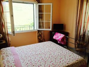 Ein Bett oder Betten in einem Zimmer der Unterkunft Villa della Mimosa