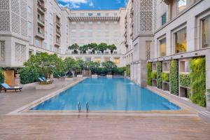 a swimming pool in the middle of a building at Lemon Tree Premier, Delhi Airport in New Delhi