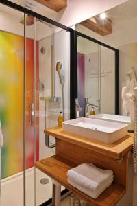 a bathroom with a sink and a shower at Hôtel Domaine A Flatta in Calenzana +48 photos