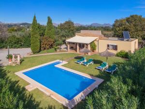 an aerial view of a house with a swimming pool at Villa Llompart Pollensa by JS Villas in Pollença