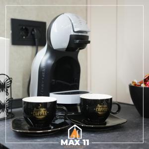 Coffee and tea making facilities at MAX 11 Apartman