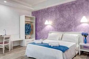 Posteľ alebo postele v izbe v ubytovaní GOCCE VILLAS - Dimoria Aster Apartment