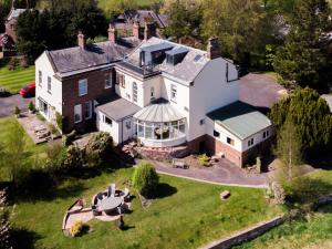 an aerial view of a large white house at 5 Bed in Carlisle 87447 in Scotby
