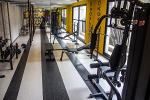 a gym with several rows of tread machines at Studio no centro de Curitiba in Curitiba