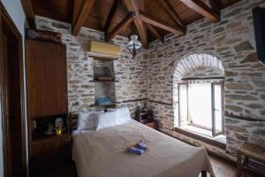 A bed or beds in a room at Archontiko Michael Pelion